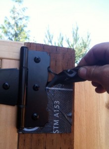 Vycor backing is peeled away from around standard coated hinge.