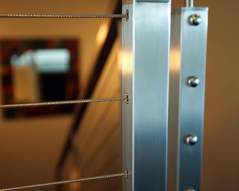Discrete stainless steel cable railing ends look great. MBA Deck and